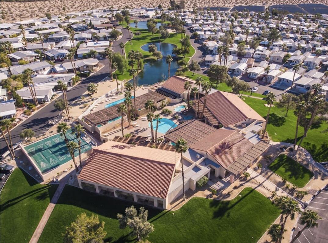 74711 Dillon Road Desert Hot Springs, CA 92241 - Photo 26 of 69 an aerial view of a city with lots of residential buildings