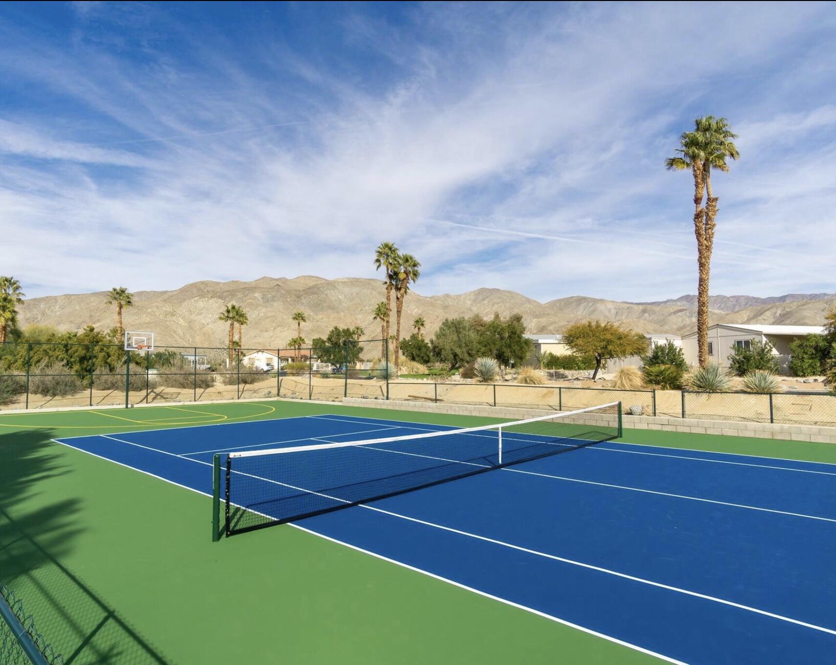 74711 Dillon Road Desert Hot Springs, CA 92241 - Photo 28 of 69 a view of a tennis court with chairs