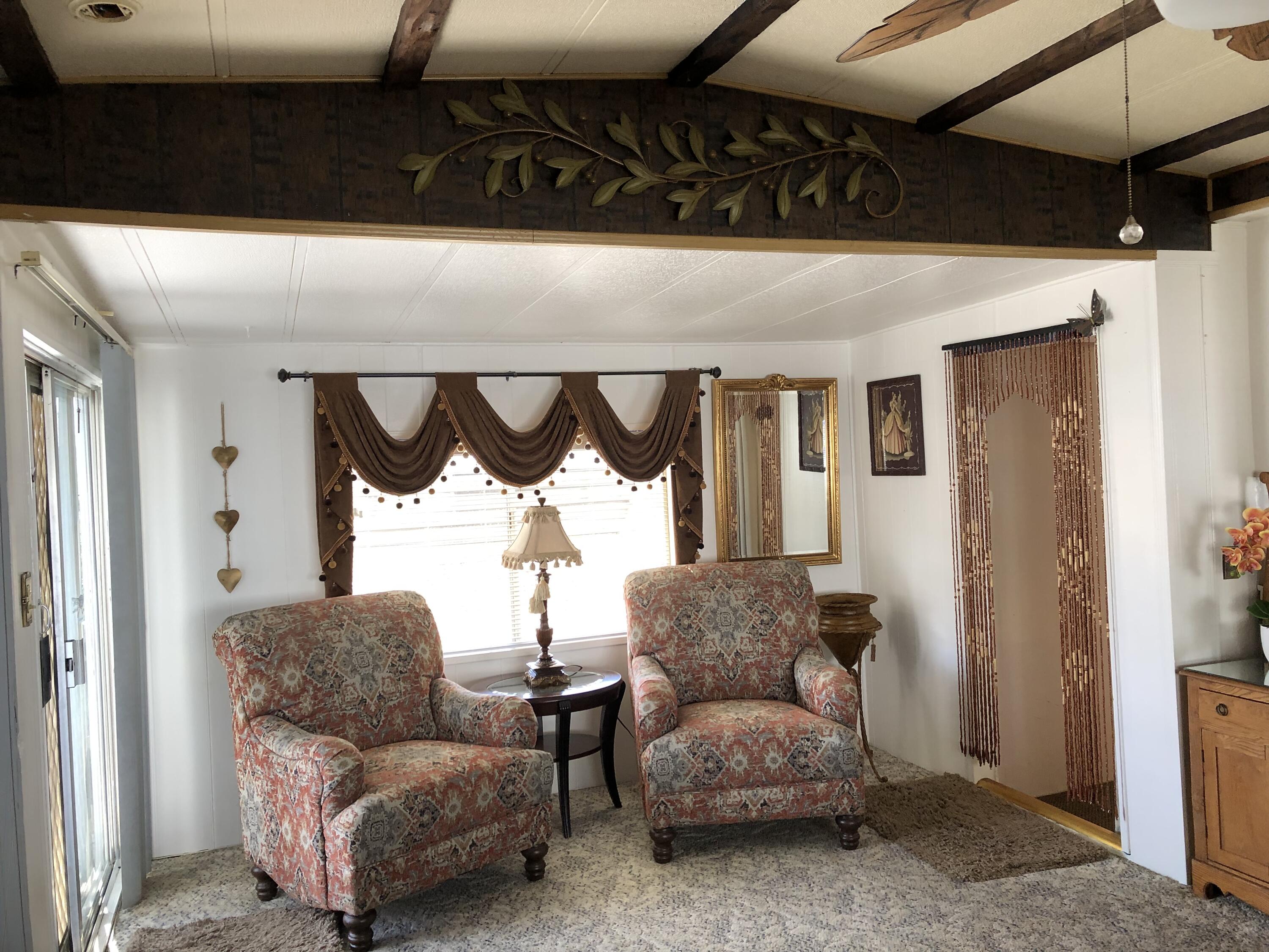 74711 Dillon Road Desert Hot Springs, CA 92241 - Photo 5 of 69 a living room with furniture and a window