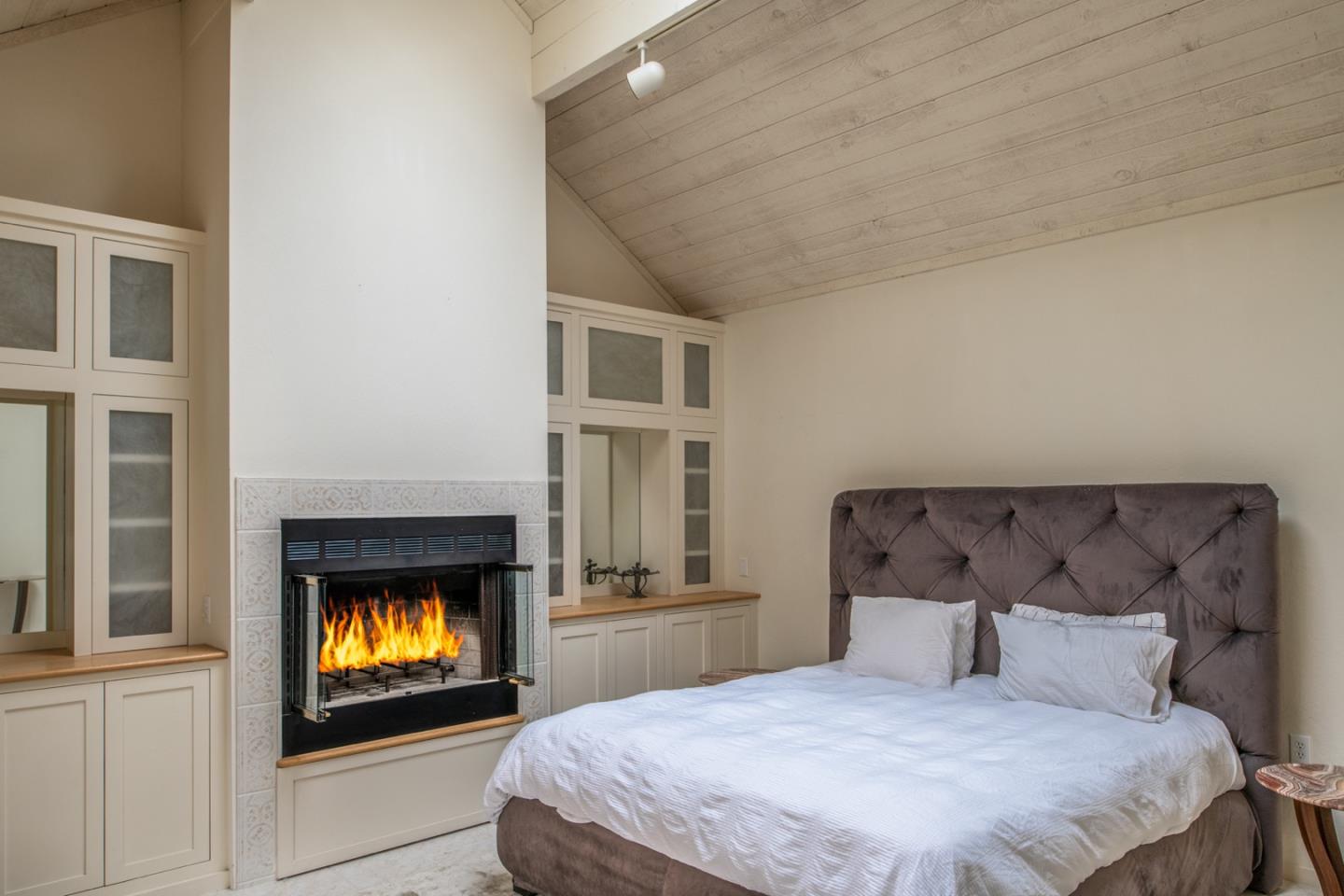 0 Northwest Nw Corner Carmel, CA 93921 - Photo 12 of 17 a bedroom with a bed and a fireplace