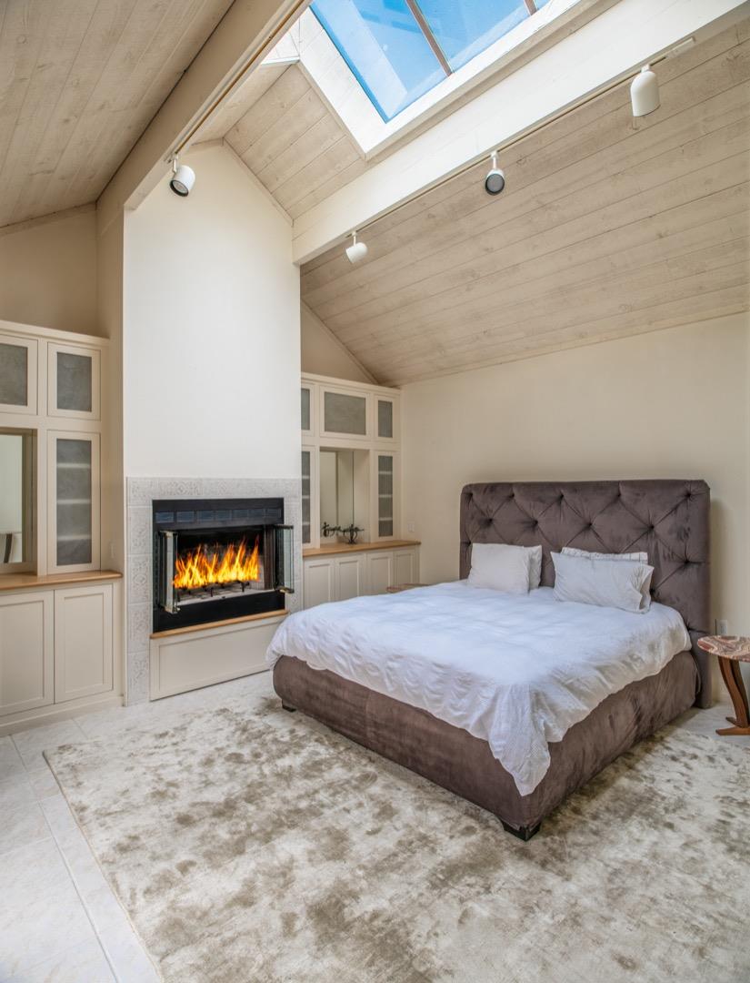 0 Northwest Nw Corner Carmel, CA 93921 - Photo 13 of 17 a spacious bedroom with a bed and a fireplace