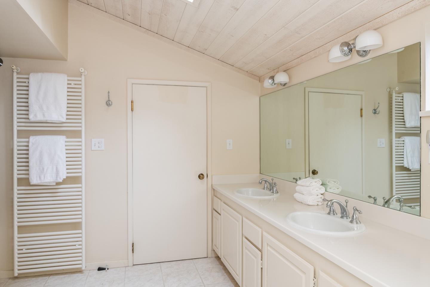 0 Northwest Nw Corner Carmel, CA 93921 - Photo 14 of 17 a bathroom with a double vanity sink and a mirror