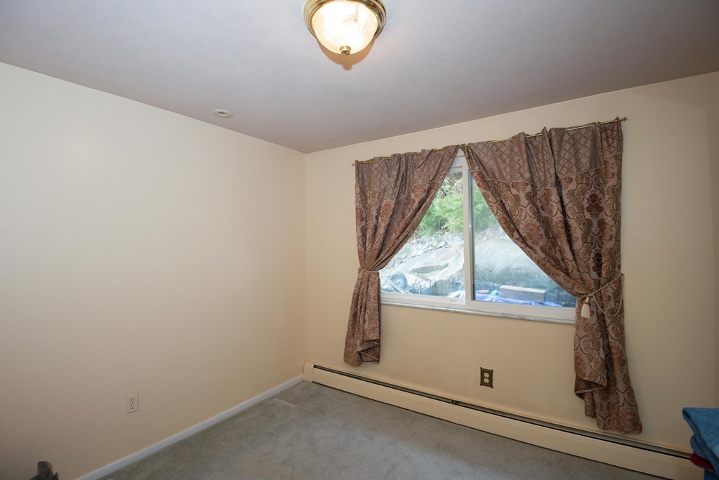 5 Fatima Road Stoneham, MA 02180 - Photo 12 of 20 an empty room with windows