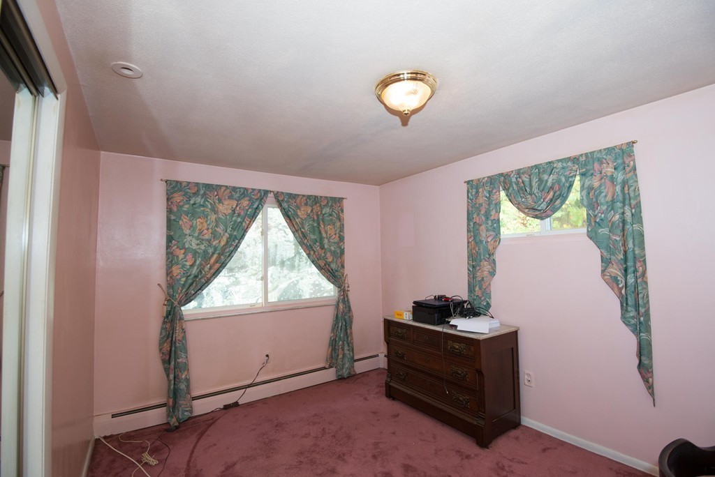 5 Fatima Road Stoneham, MA 02180 - Photo 13 of 20 a view of room with window and air conditioner