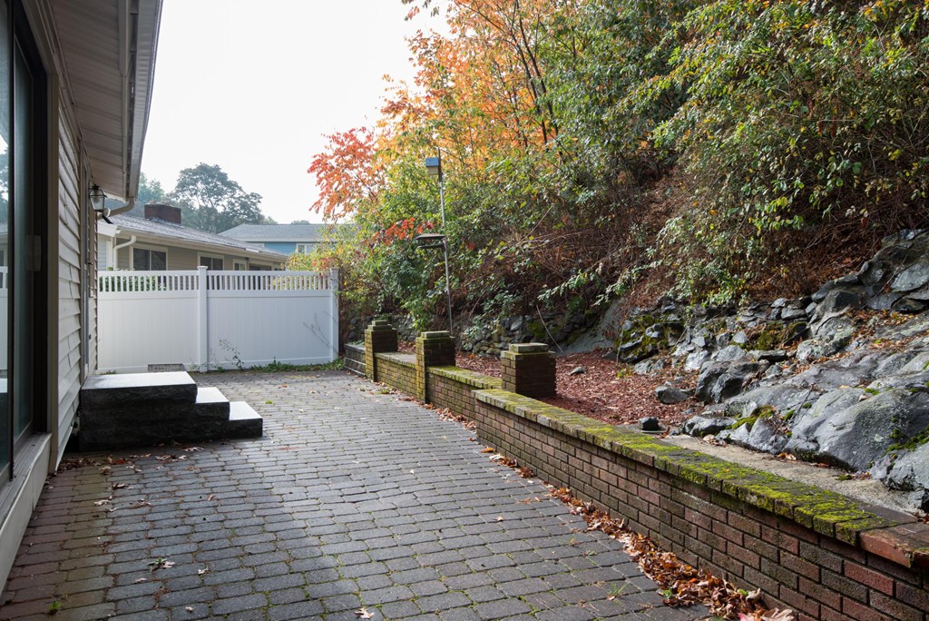 5 Fatima Road Stoneham, MA 02180 - Photo 17 of 20 a backyard of a house with seating space