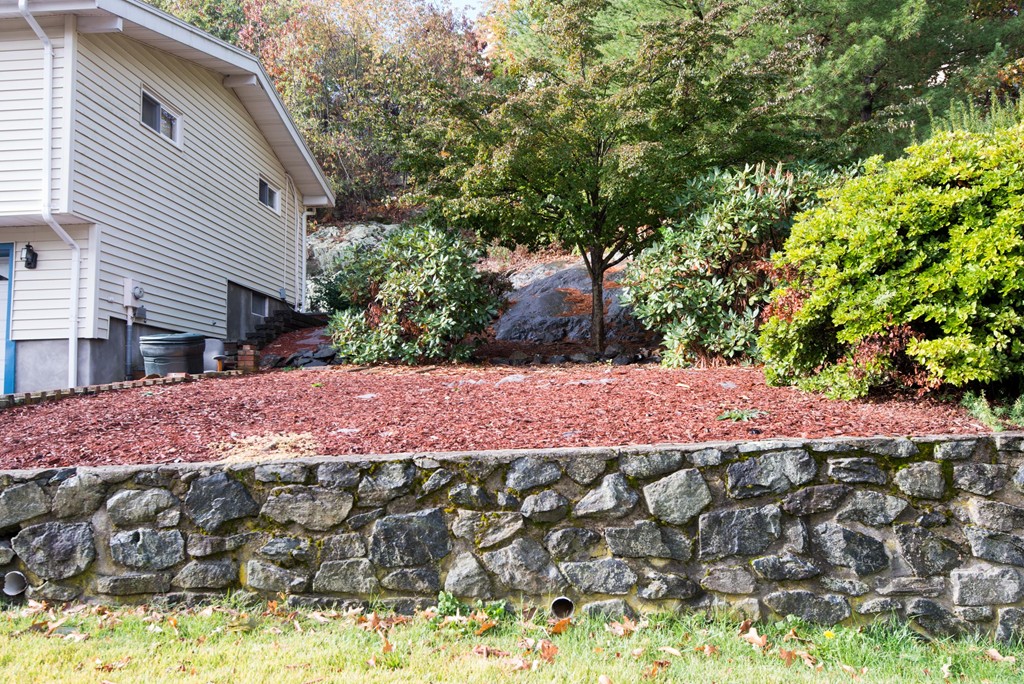 5 Fatima Road Stoneham, MA 02180 - Photo 20 of 20 a view of a backyard with a garden