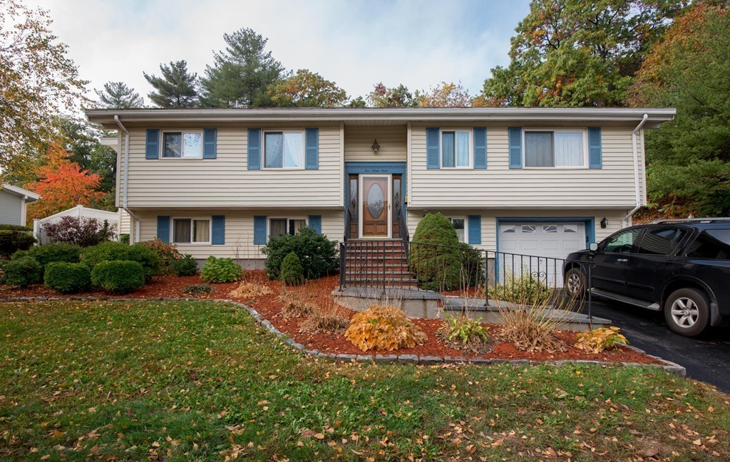 5 Fatima Road Stoneham, MA 02180 - Photo 3 of 20 front view of a house with a yard