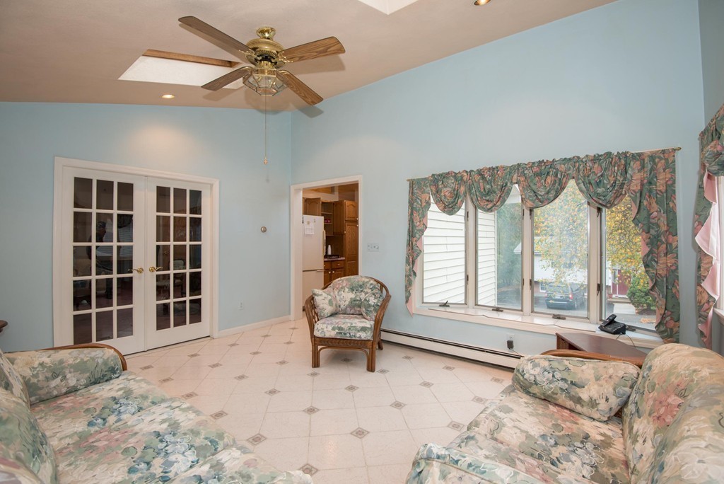 5 Fatima Road Stoneham, MA 02180 - Photo 5 of 20 a living room with a bed furniture and a large window