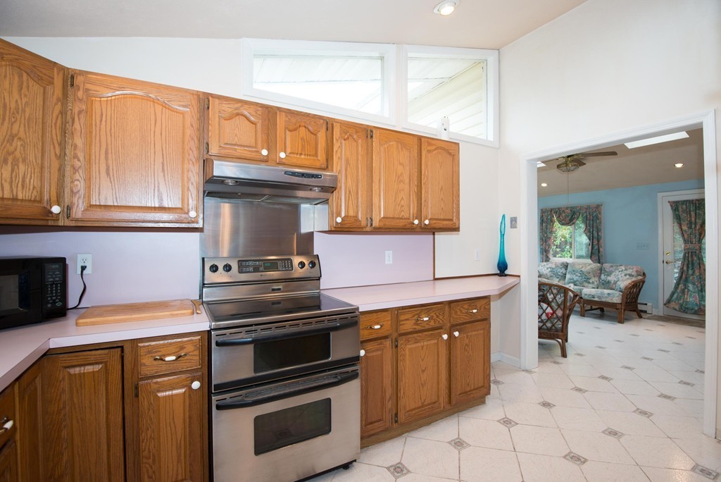 5 Fatima Road Stoneham, MA 02180 - Photo 7 of 20 a kitchen with a stove and a sink