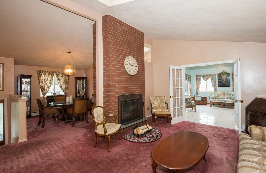 5 Fatima Road Stoneham, MA 02180 - Photo 9 of 20 a living room with furniture and a fireplace