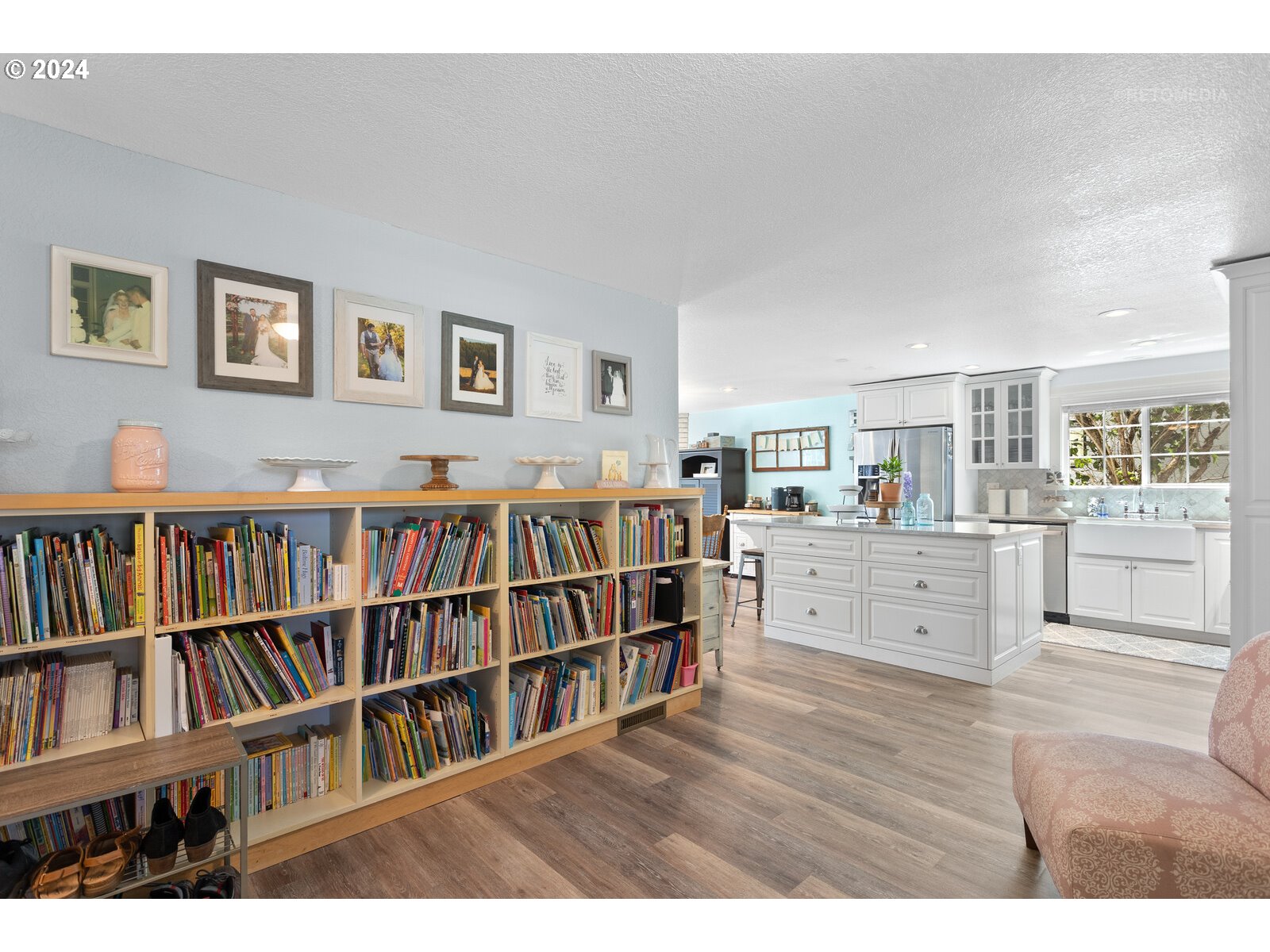 780 South Elm Court Canby, OR 97013 - Photo 17 of 32 a room with a book shelf and a window