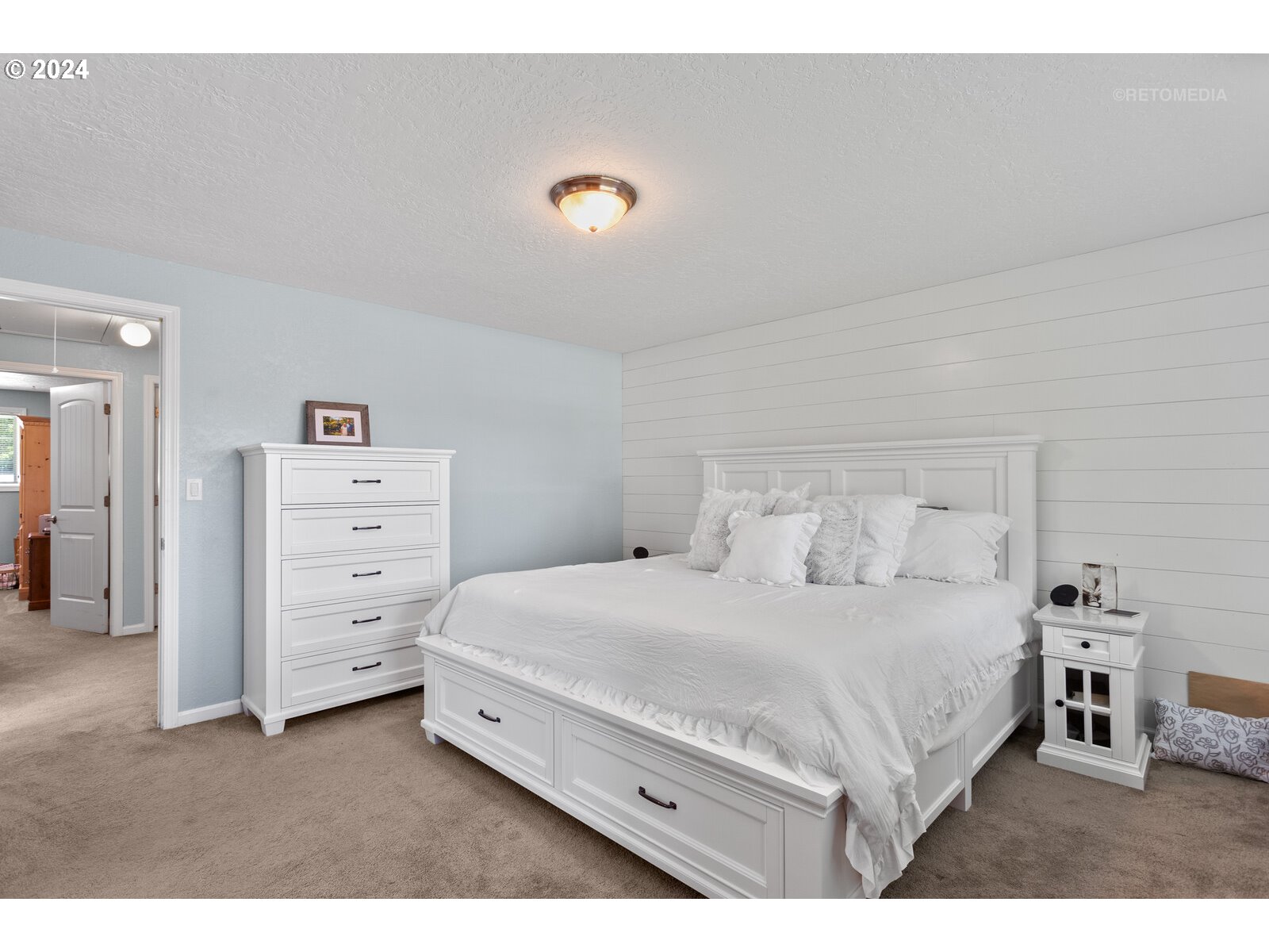 780 South Elm Court Canby, OR 97013 - Photo 19 of 32 a bedroom with a bed and a cabinets