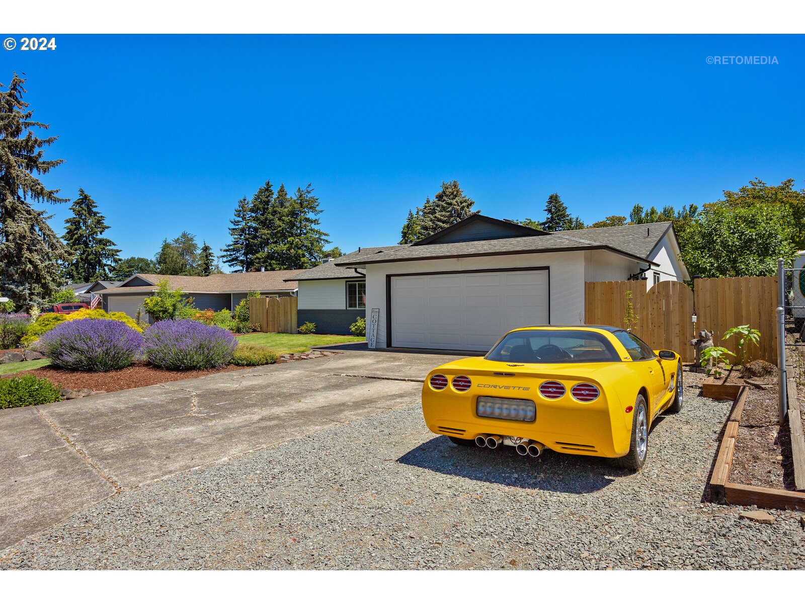 780 South Elm Court Canby, OR 97013 - Photo 2 of 32 a view of a house with backyard space and a car parked
