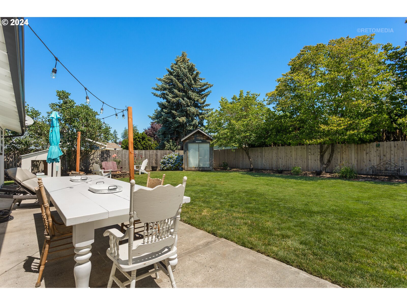 780 South Elm Court Canby, OR 97013 - Photo 26 of 32 a view of a house with backyard and sitting area