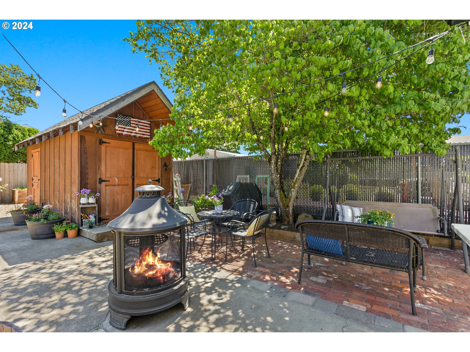 780 South Elm Court Canby, OR 97013 - Photo 27 of 32 a backyard of a house with seating space