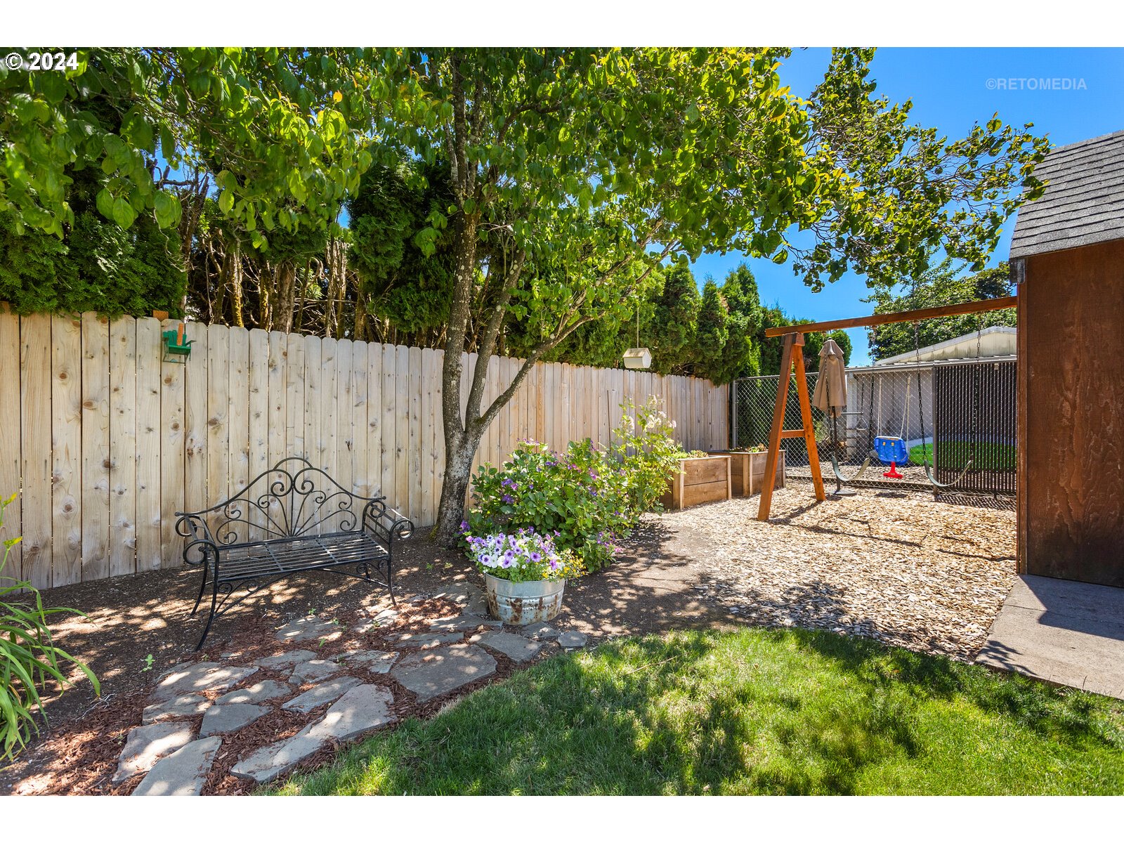 780 South Elm Court Canby, OR 97013 - Photo 30 of 32 a view of backyard with a table and chairs
