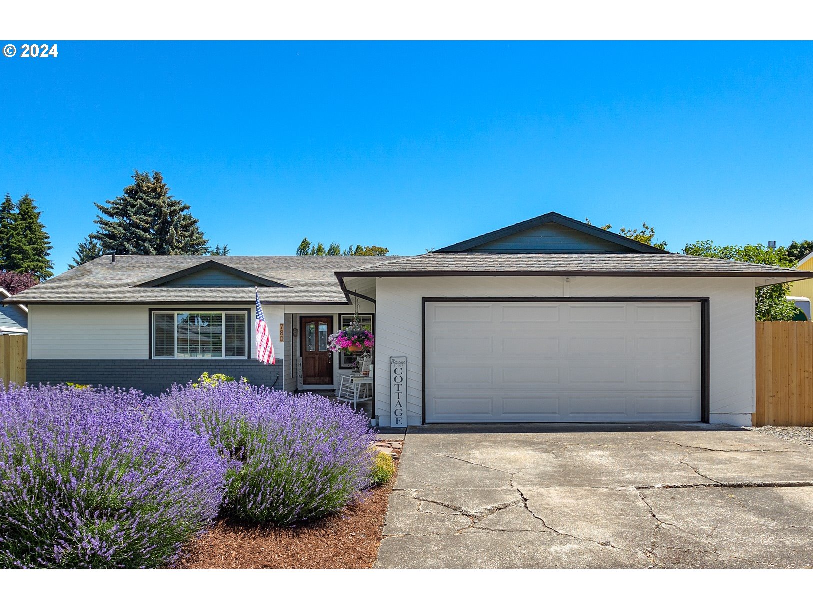 780 South Elm Court Canby, OR 97013 - Photo 3 of 32 a front view of a house with a yard