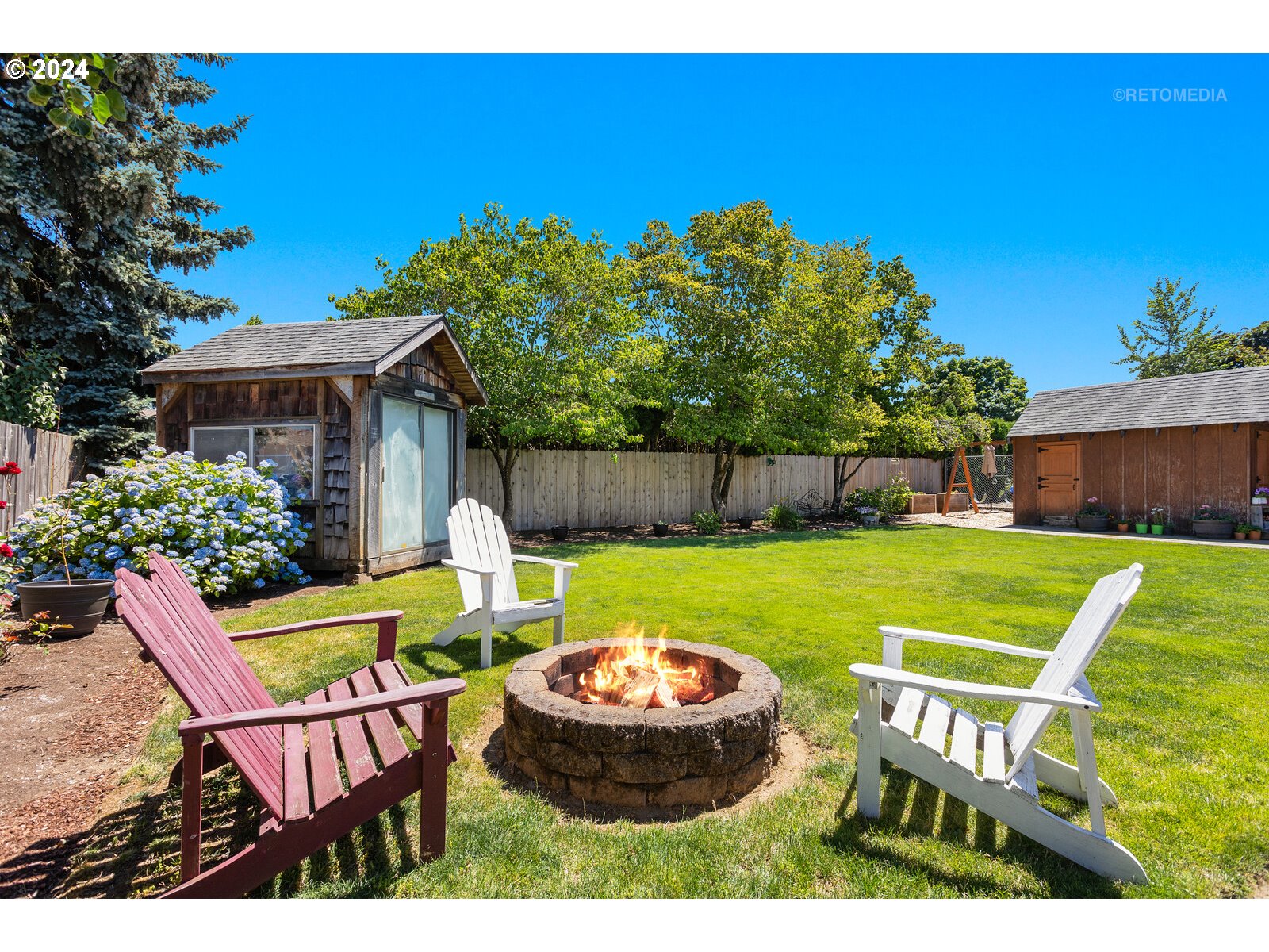 780 South Elm Court Canby, OR 97013 - Photo 32 of 32 a view of a house with backyard and sitting area