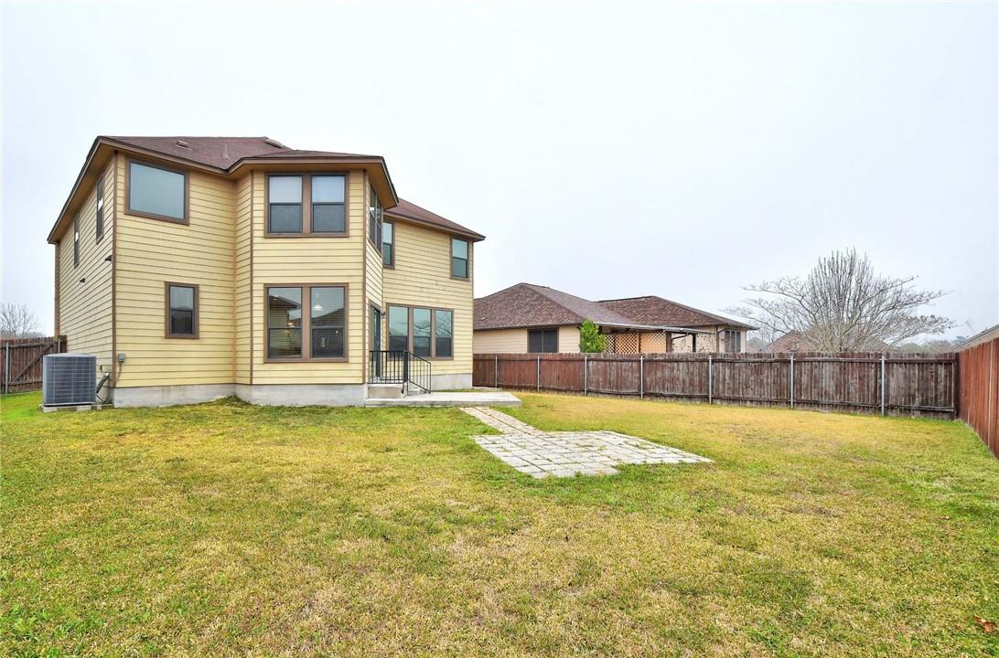356 Matthews Kyle, TX 78640 - Photo 21 of 30 A spacious backyard with mature fencing offers ample room for outdoor activities.