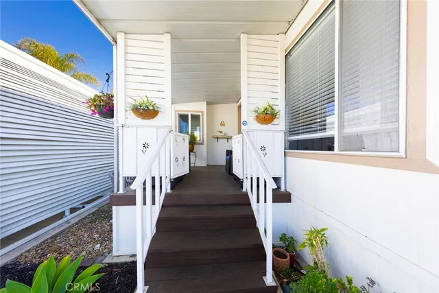 a living room with furniture and flowers