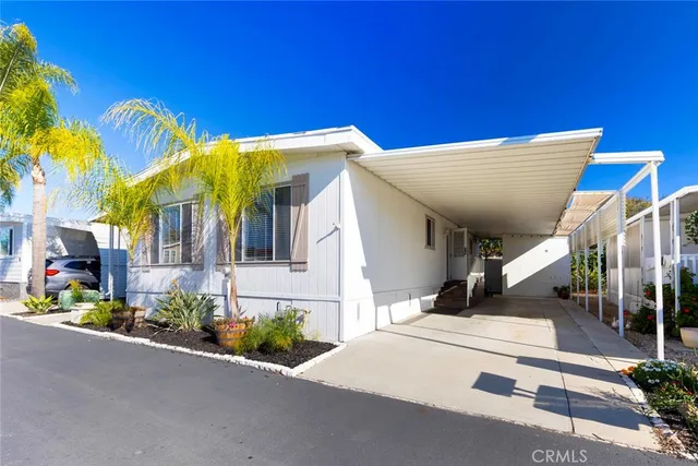 a view of a house with fountain and a street