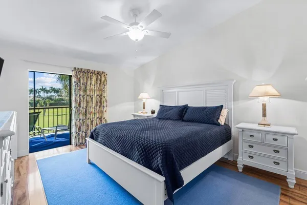 a spacious bedroom with a bed and a window