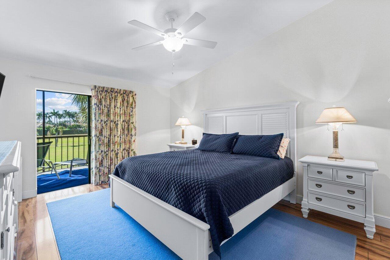 5120 Golfview Court, Unit 1722 Delray Beach, FL 33484 - Photo 12 of 46 a spacious bedroom with a bed and a window
