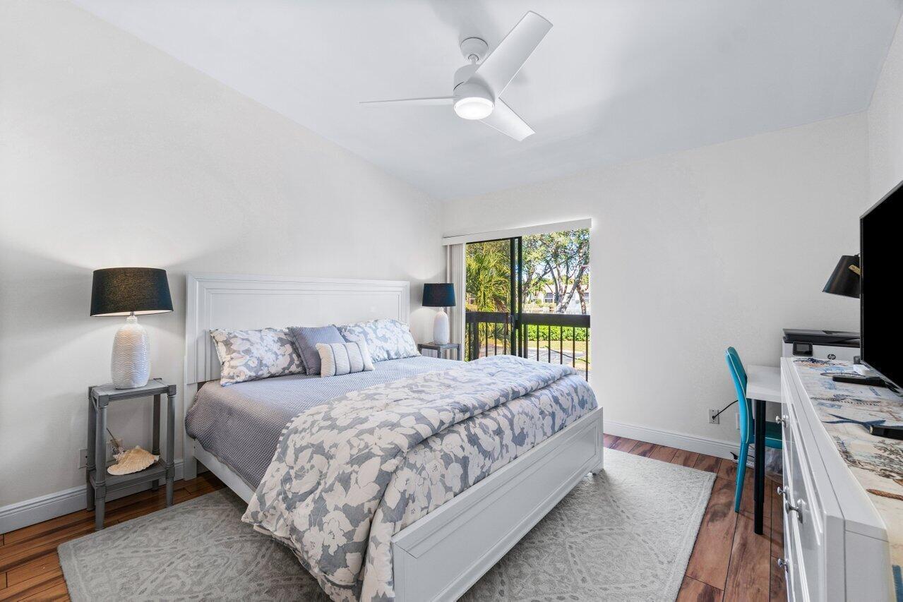 5120 Golfview Court, Unit 1722 Delray Beach, FL 33484 - Photo 15 of 46 a bedroom with a bed and a window