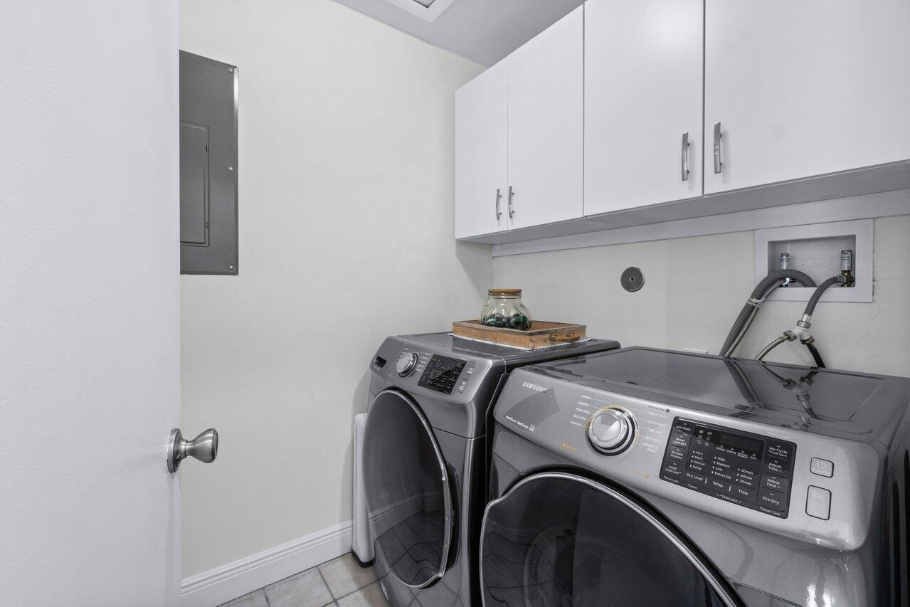 5120 Golfview Court, Unit 1722 Delray Beach, FL 33484 - Photo 18 of 46 a utility room with dryer and washer