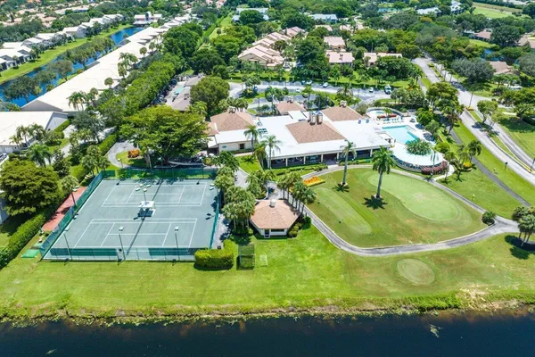 an aerial view of a house with a swimming pool yard and outdoor seating