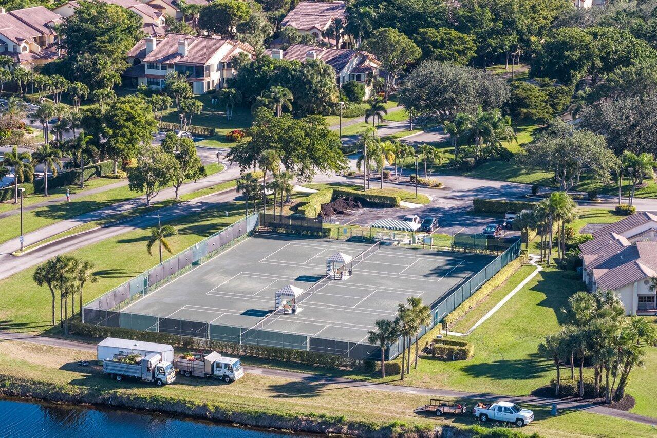 5120 Golfview Court, Unit 1722 Delray Beach, FL 33484 - Photo 32 of 46 an aerial view of a house with a swimming pool yard and outdoor seating