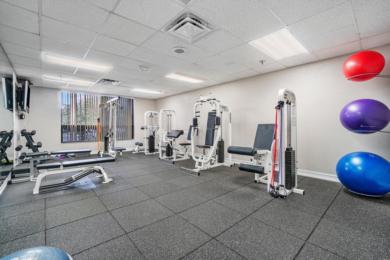 5120 Golfview Court, Unit 1722 Delray Beach, FL 33484 - Photo 36 of 46 a view of a room with gym equipment