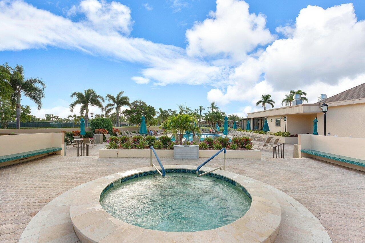 5120 Golfview Court, Unit 1722 Delray Beach, FL 33484 - Photo 37 of 46 a view of a swimming pool with a patio