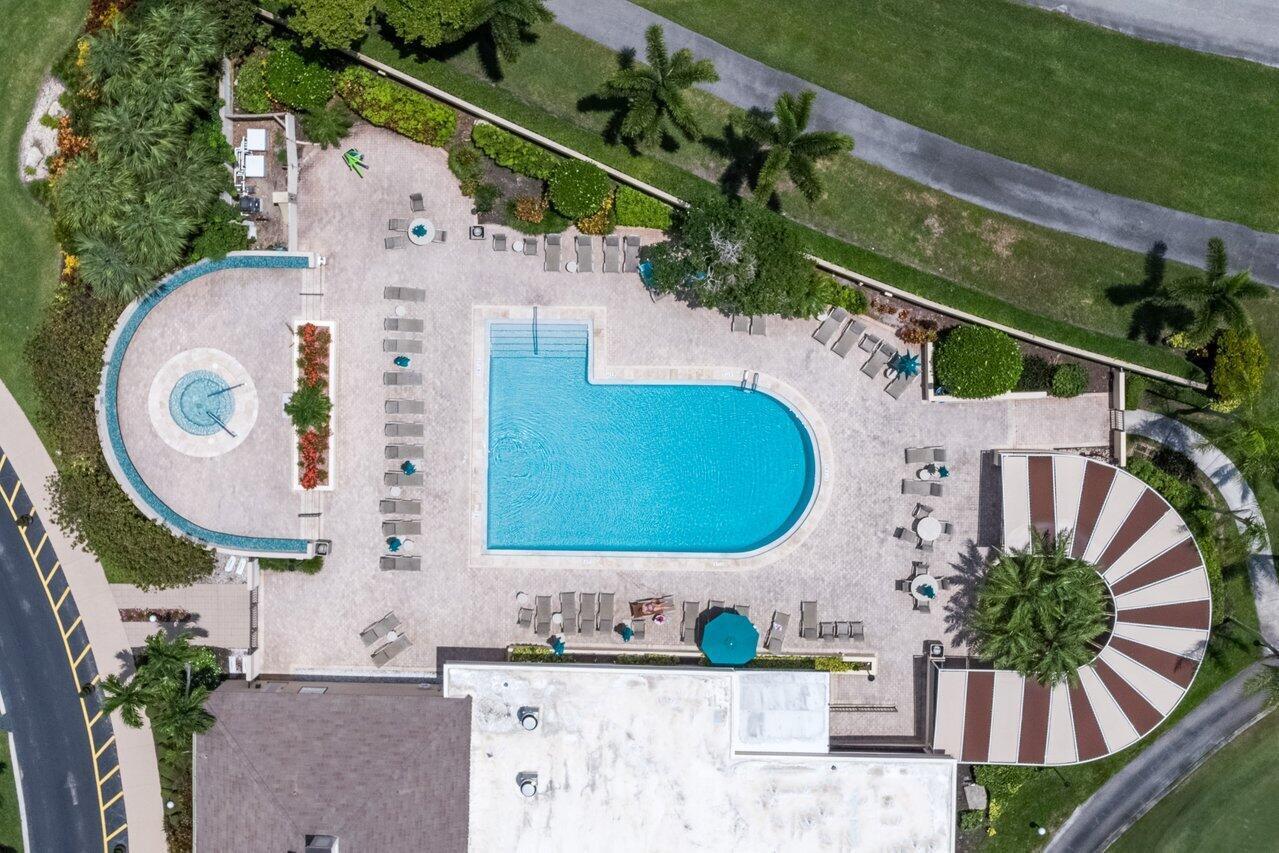 5120 Golfview Court, Unit 1722 Delray Beach, FL 33484 - Photo 41 of 46 an aerial view of a house with a swimming pool outdoor seating and yard