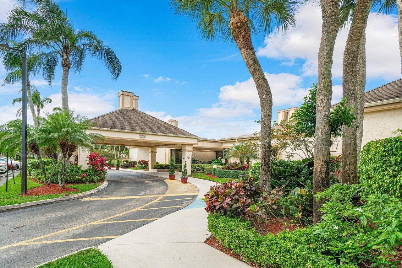 5120 Golfview Court, Unit 1722 Delray Beach, FL 33484 - Photo 43 of 46 a view of a fountain in front of a house
