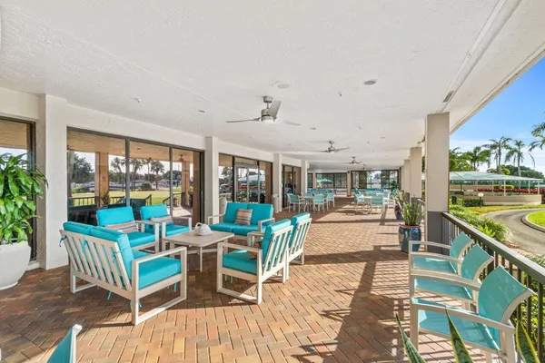 a view of a dining room with furniture window and outdoor view