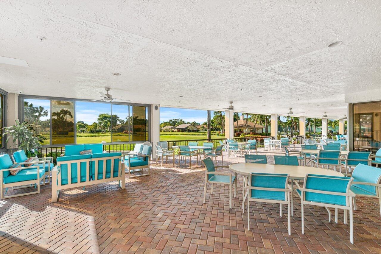 5120 Golfview Court, Unit 1722 Delray Beach, FL 33484 - Photo 45 of 46 a view of a dining room with furniture window and outdoor view