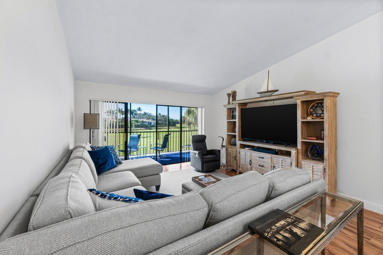 5120 Golfview Court, Unit 1722 Delray Beach, FL 33484 - Photo 8 of 46 a living room with furniture and a flat screen tv