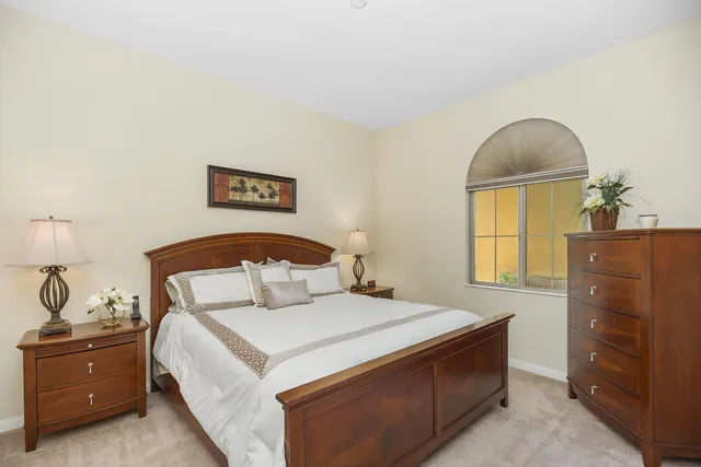 a view of a swimming pool with lounge chairs