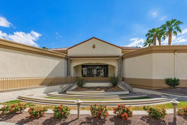 a street sign on a wall next to a building