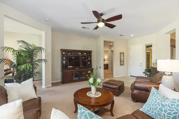 a kitchen with stainless steel appliances kitchen island granite countertop a sink stove and refrigerator