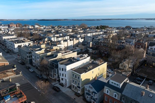 an aerial view of a building with parking space