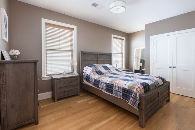 a bedroom with a bed and window