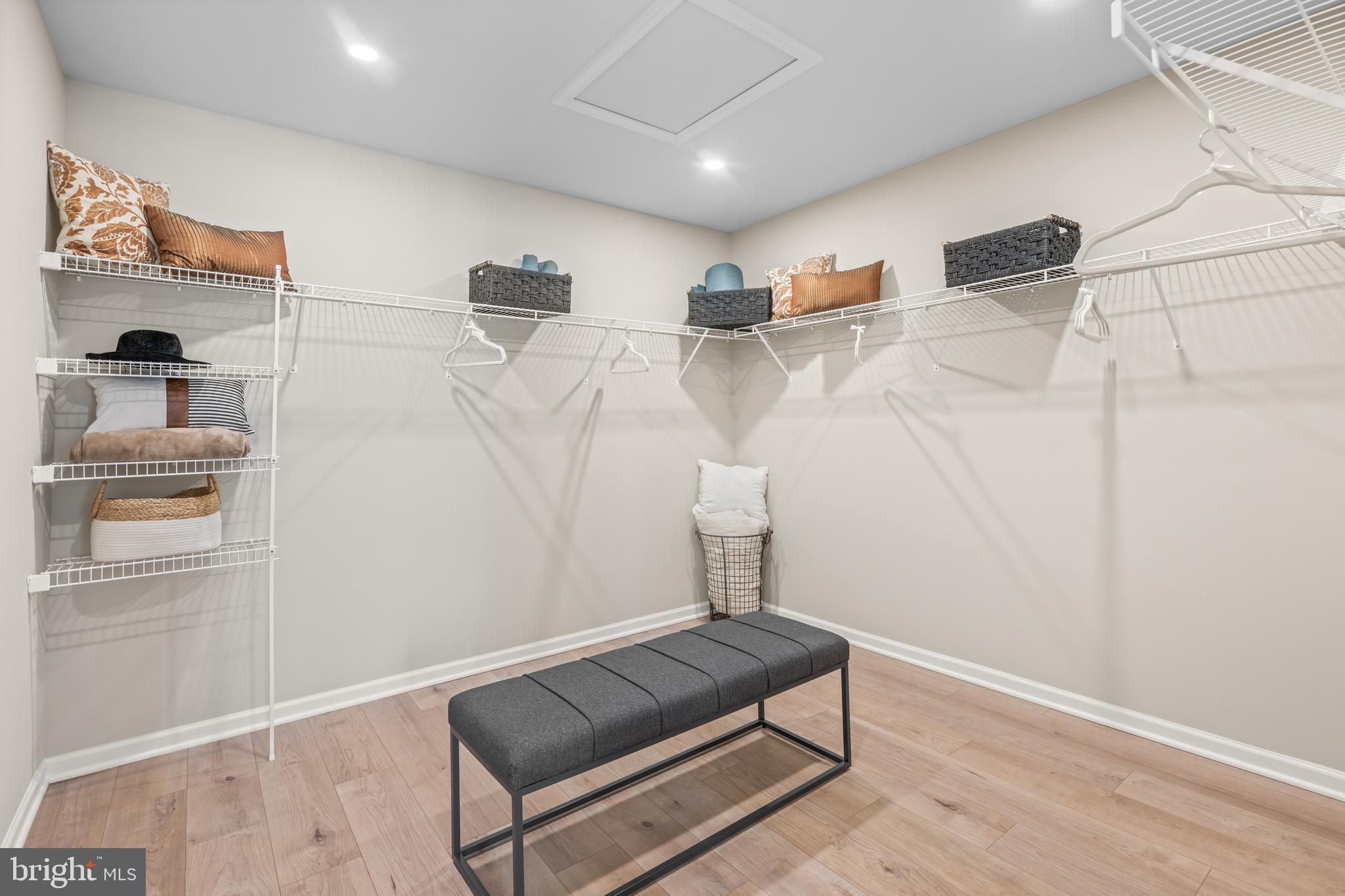 150 Foragers Lane Kennett Square, PA 19348 - Photo 20 of 33 a hallway with a couch and a potted plant on the wall