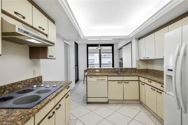 a kitchen with stainless steel appliances granite countertop a stove and a sink