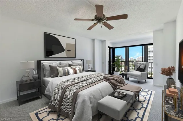 a bedroom with a bed and glass window