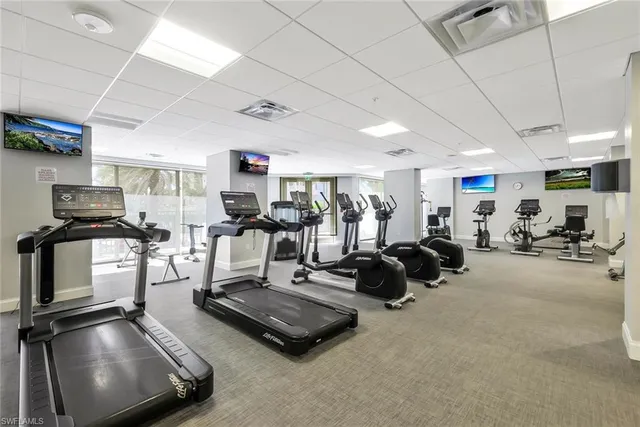 a room with gym equipment and a mirror