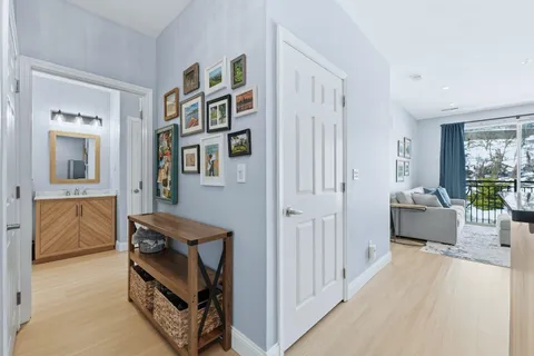 a view of livingroom with furniture and workspace