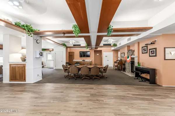 a view of a house with pool and chairs