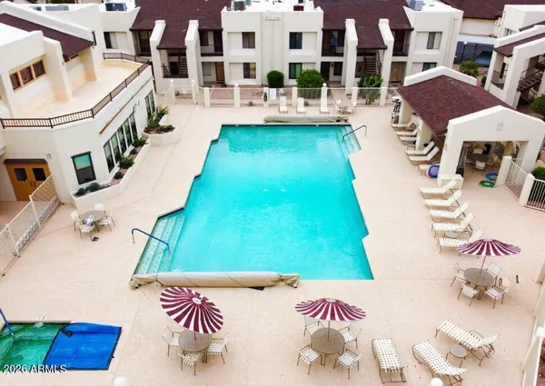 a living room with furniture and a painting